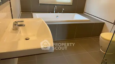 Modern bathroom with sleek bathtub and stylish fixtures