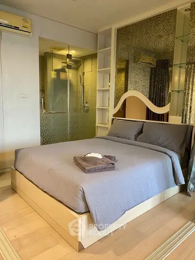 Cozy bedroom with modern ensuite bathroom and stylish decor