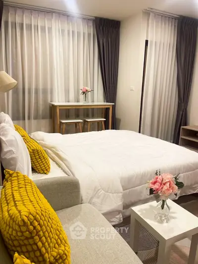 Cozy bedroom with modern decor and bright yellow accents