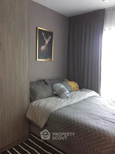 Cozy bedroom with stylish decor and natural light