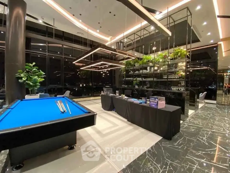 Luxurious modern building lobby with pool table and elegant decor