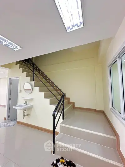 Modern interior with staircase and sleek design, perfect for contemporary living.