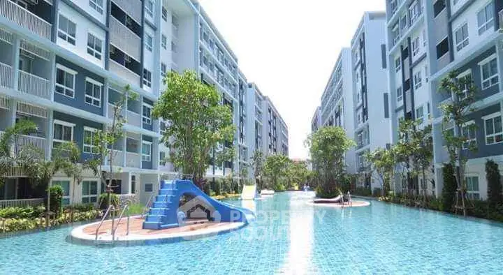 Luxurious apartment complex with stunning swimming pool and lush greenery
