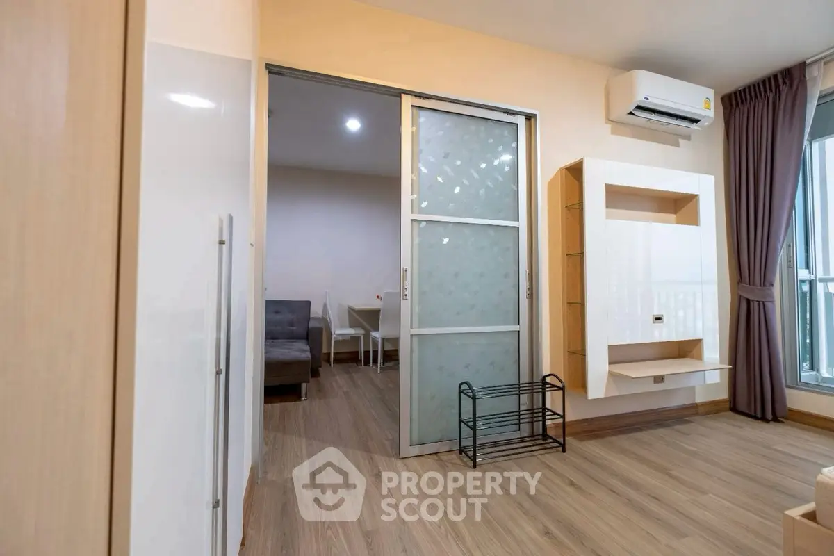 Modern apartment interior with sliding door and air conditioning