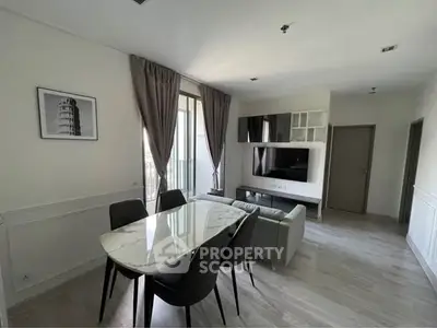 Modern living room with elegant dining area and stylish decor