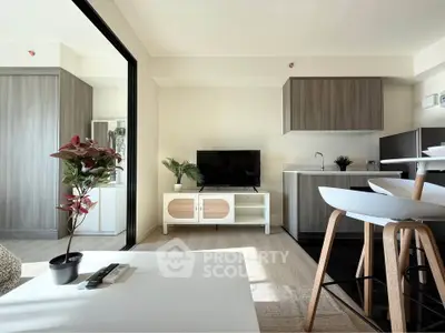 Modern open-plan living room with sleek kitchen and stylish decor