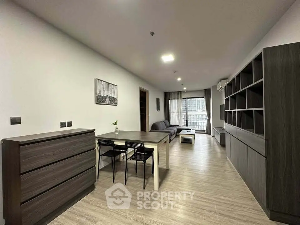 Spacious modern living room with sleek furniture and open layout, perfect for urban living.