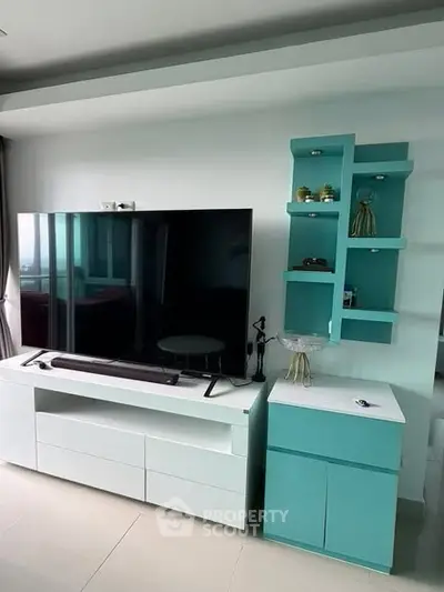Modern living room with sleek TV unit and stylish shelving