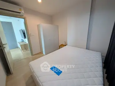 Modern bedroom with air conditioning and minimalist furniture in a stylish apartment.