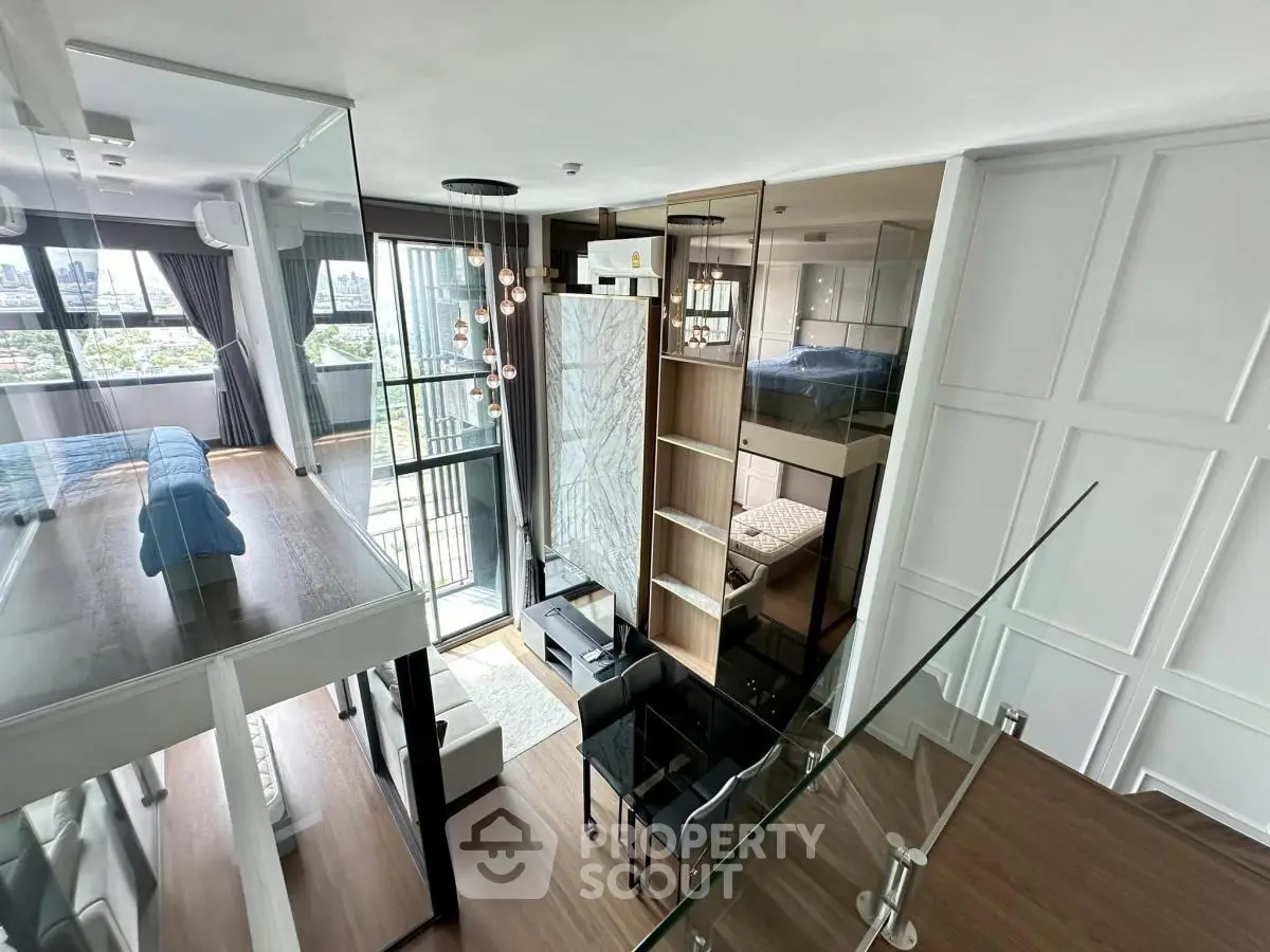 Modern loft apartment with mezzanine bedroom and stylish open living area, featuring floor-to-ceiling windows and city views.