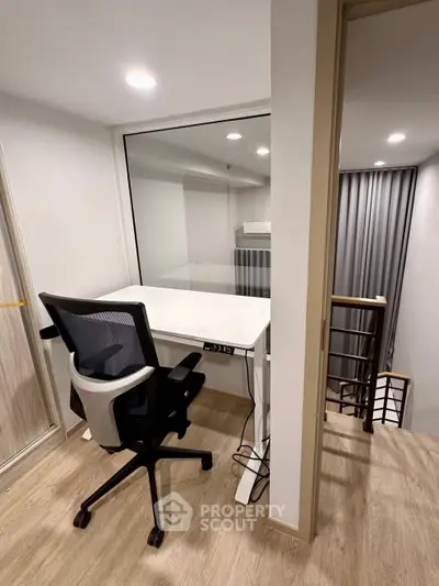 Modern study nook with ergonomic chair and desk in stylish apartment