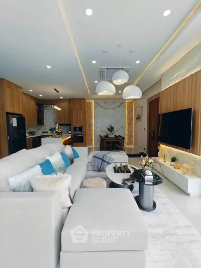 Luxurious modern living room with elegant decor and open kitchen layout