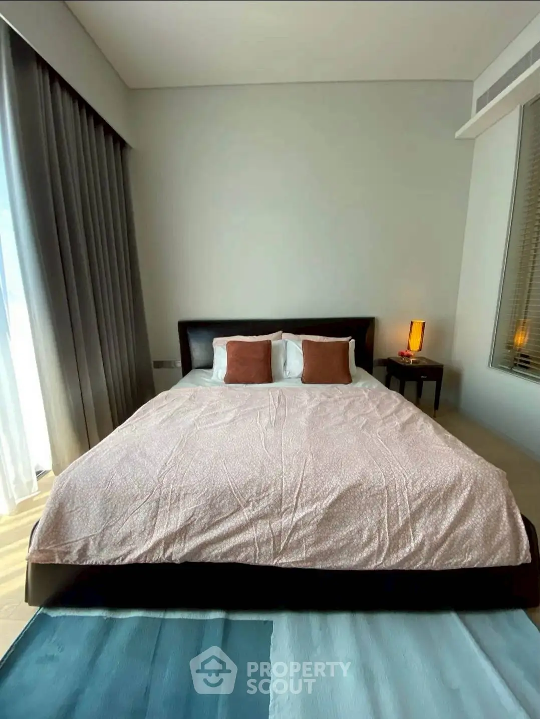 Modern bedroom with stylish decor and natural light