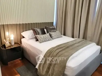 Cozy modern bedroom with elegant decor and soft lighting, perfect for relaxation.