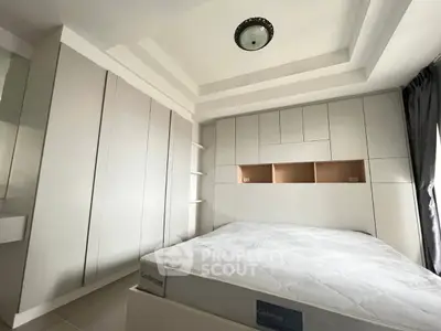 Modern bedroom with built-in storage and sleek design