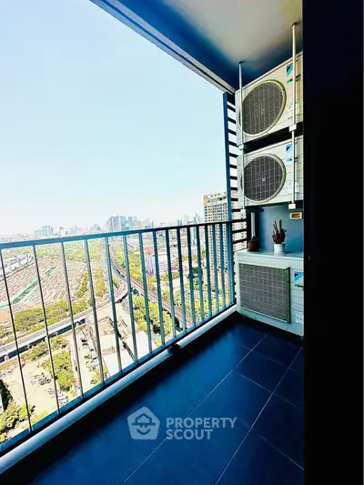 Spacious balcony with stunning city view and modern air conditioning units.