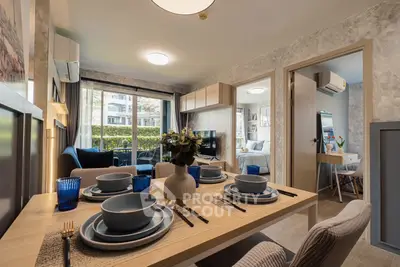 Modern living room with dining area and stylish decor in a cozy apartment.