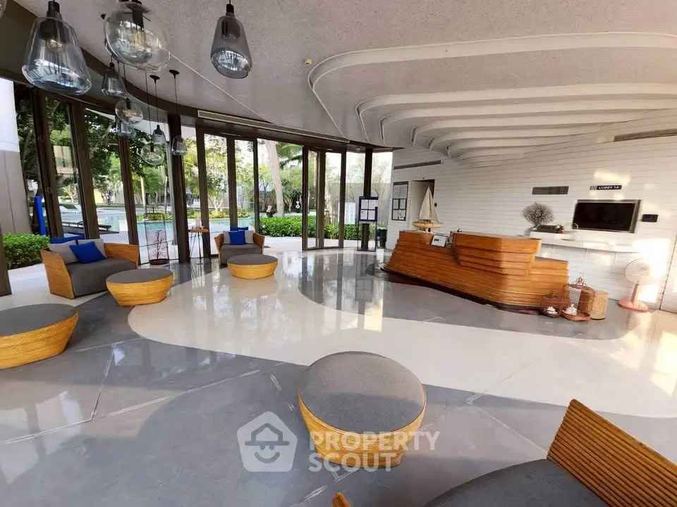 Luxurious modern lobby with stylish seating and elegant lighting, perfect for welcoming guests in a high-end building.