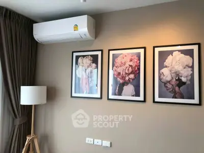 Stylish living room with modern art and air conditioning unit