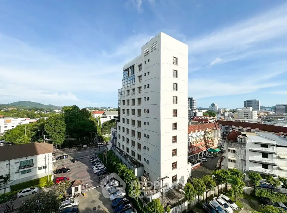 Stunning high-rise building with panoramic city views and lush greenery, perfect for urban living.