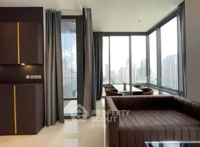Luxurious corner unit living room with panoramic city views and modern furnishings.