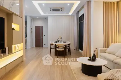 Modern open-layout living room with elegant dining area and stylish decor