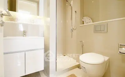 Modern bathroom with sleek fixtures and a spacious shower area.