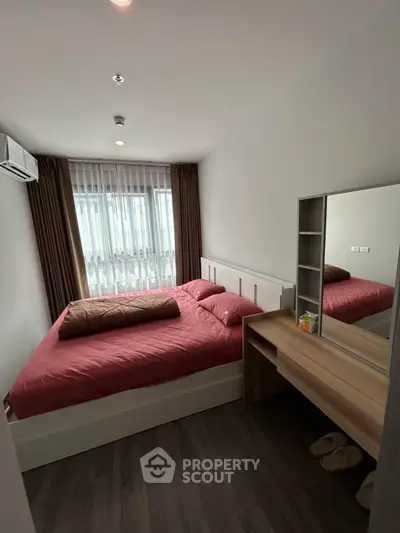 Cozy bedroom with modern furnishings and natural light