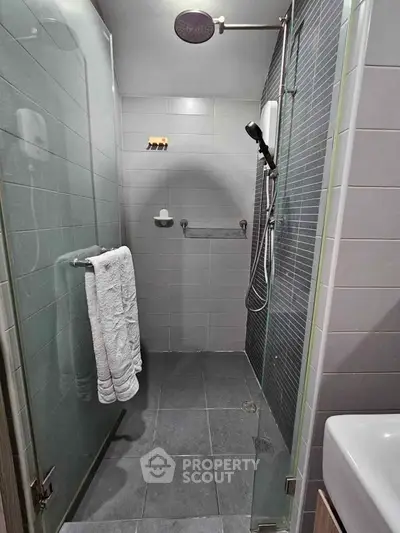 Modern bathroom with sleek shower design and glass door