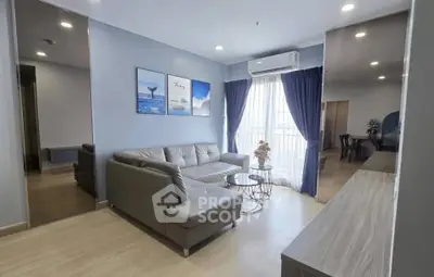 Modern living room with sleek furniture and natural light in a stylish apartment.