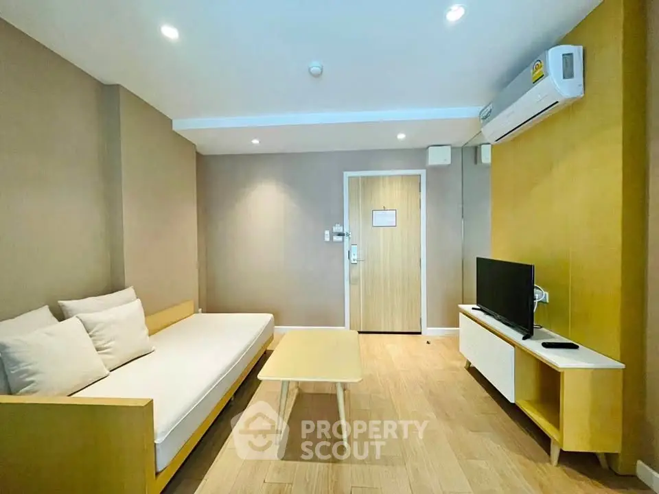 Modern living room with minimalist furniture and air conditioning