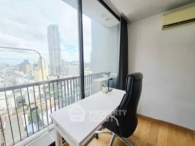 Modern study room with city view, featuring sleek desk and ergonomic chair, perfect for productivity.