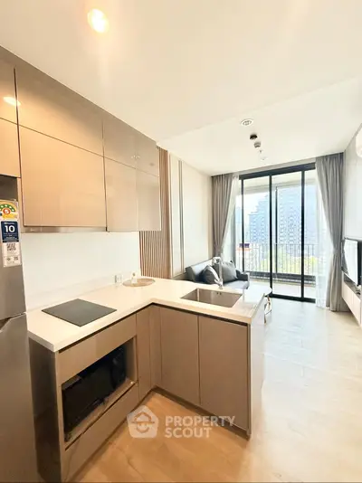 Modern open-layout kitchen and living room with city view balcony in luxury apartment