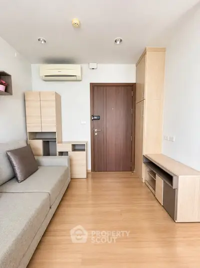 Modern living room with wooden flooring and stylish furniture