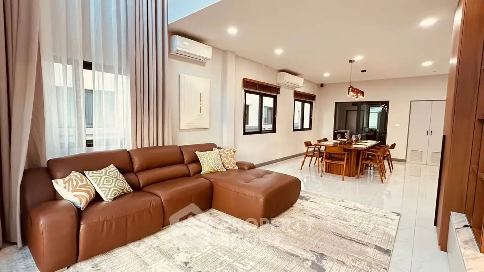 Spacious modern living room with elegant dining area and stylish decor