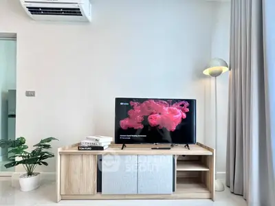 Modern living room with stylish TV stand and air conditioning