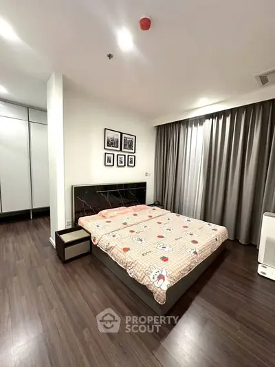 Spacious bedroom with modern decor and ample natural light