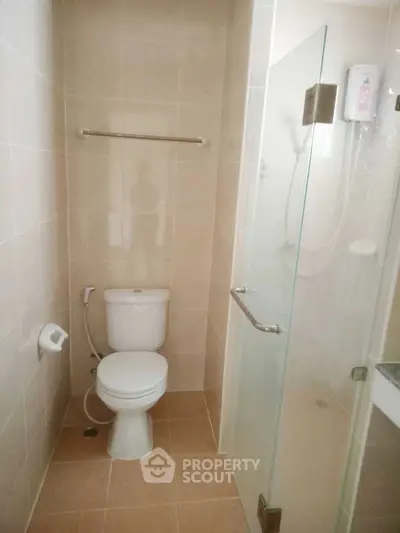 Compact bathroom with glass shower and modern fixtures