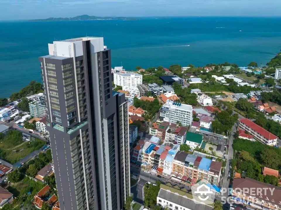 Stunning high-rise building with ocean view in vibrant coastal cityscape