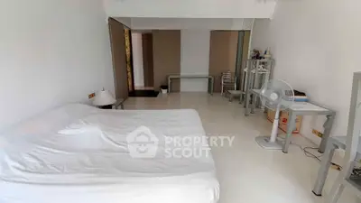 Spacious minimalist bedroom with modern furniture and natural light
