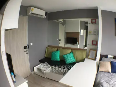 Modern living room with stylish decor and cozy seating in a contemporary apartment.