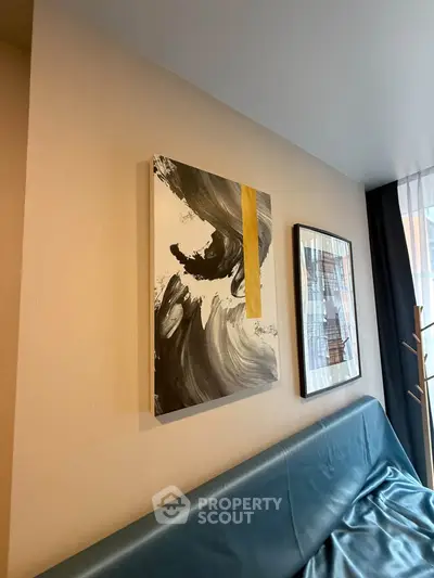 Modern living room with abstract art and stylish decor