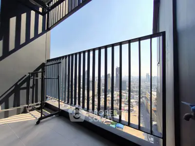 Stunning cityscape view from a modern high-rise balcony, perfect for urban living.