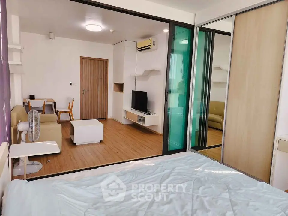 Modern studio apartment with open layout and stylish furnishings