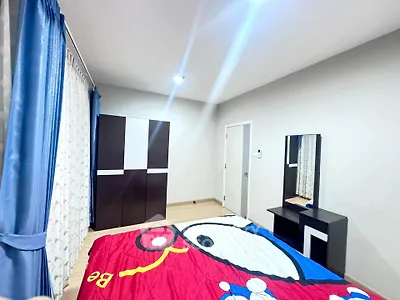 Bright bedroom with modern furniture and colorful bedding