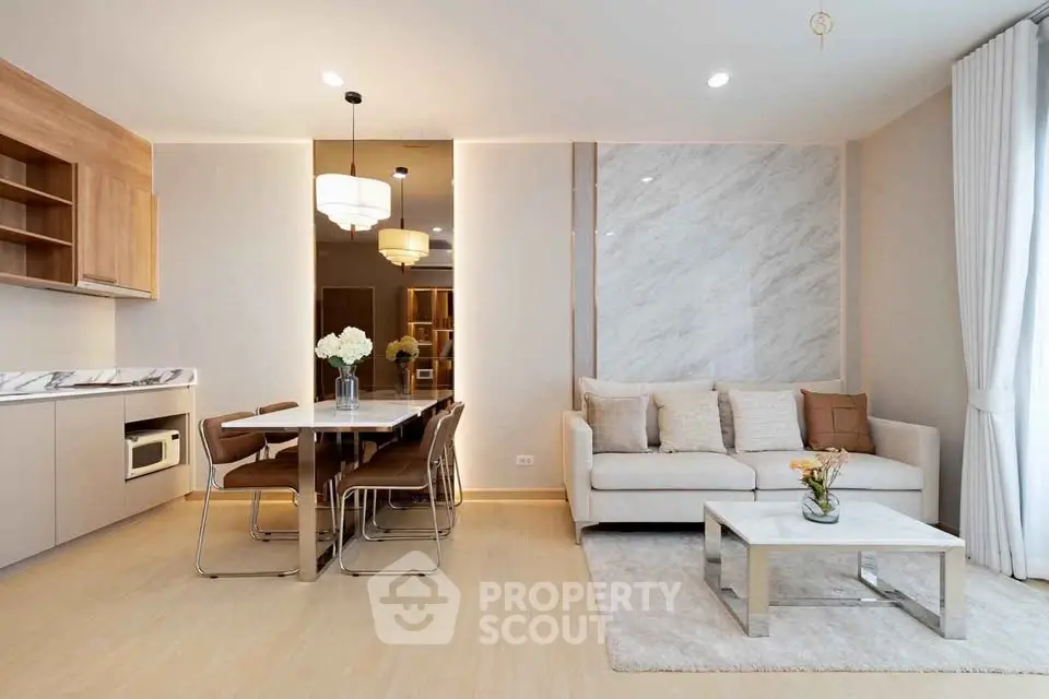 Modern living room with elegant dining area and stylish decor