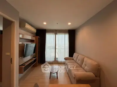 Modern living room with cozy sofa and large window view