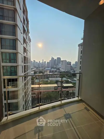 Stunning city view from a modern balcony in a high-rise building, perfect for urban living.