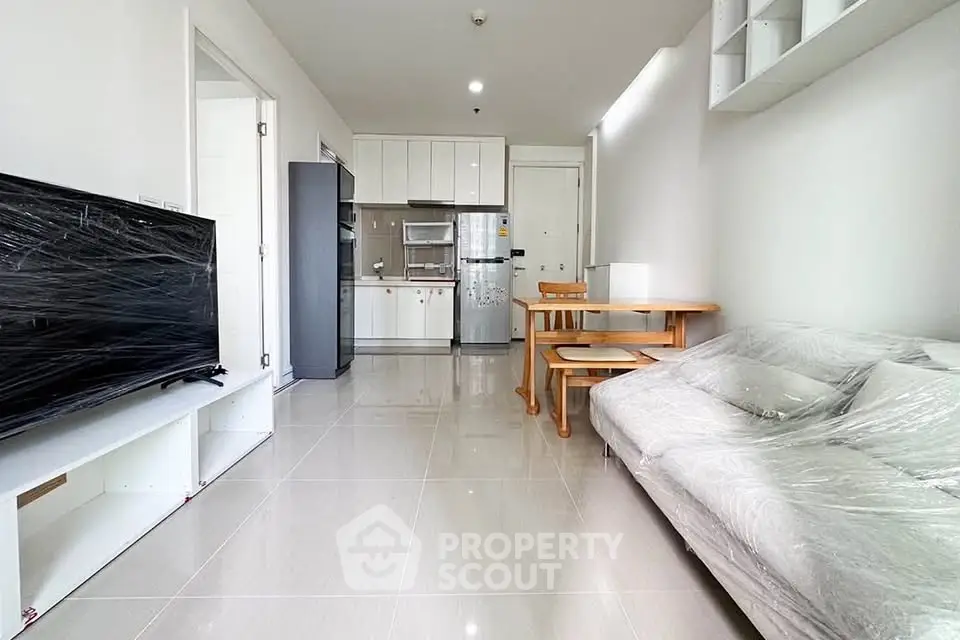 Modern living room with sleek kitchen in open layout apartment