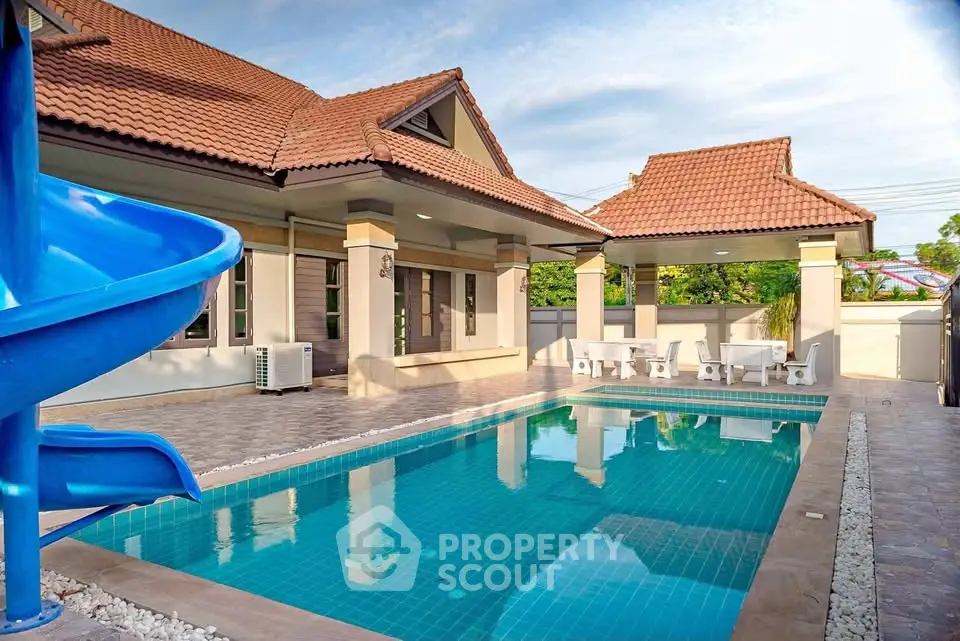 Stunning villa with private pool and slide, perfect for family fun and relaxation.